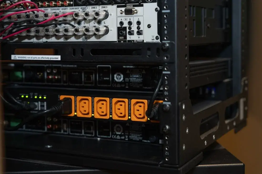 Home theater AV rack with receiver, power conditioner and speaker connections