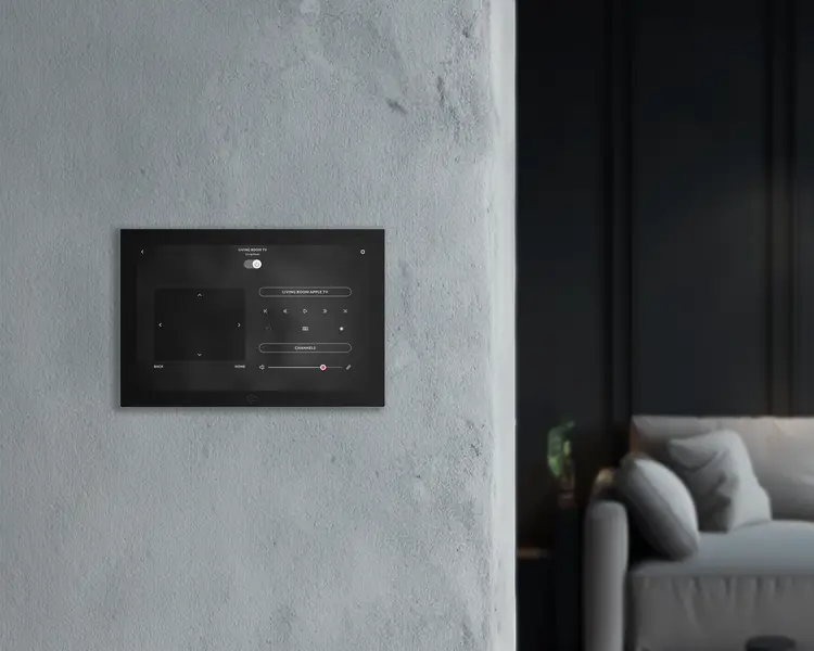 In-wall touch panel controlling a living room television and volume